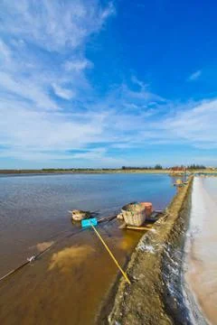 Salt fields in thailand Stock Photos