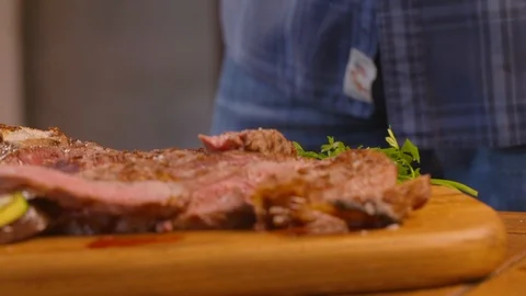 Salt flakes being sprinkled on the cooked meat Stock Footage 86171315