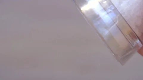 Salt grinder adding salt crystals to food. Filmed in slow motion Stock-Footage 75255212