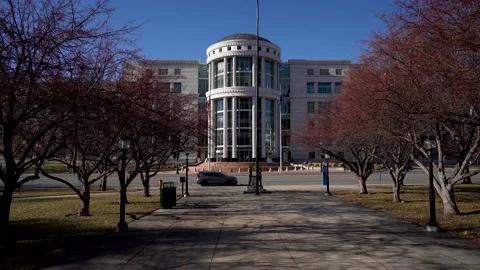 Salt Lake City Courthouse flag fliyng in the wind pan up Stock Footage