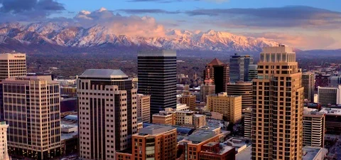Salt Lake City Utah Skyline at Sunset with Mountains, Aerial Drone Stock Footage