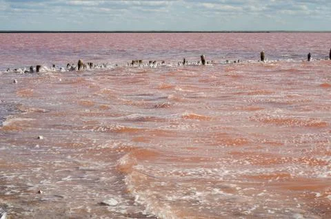 Salt lake. Clouds on a background of red water Stock Photos
