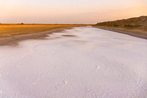 Salt lying on the ground in different patterns. Neftchala. Azerbaijan. Stock Photos