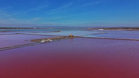Salt mine area shows large pools of mineral-rich water and machinery Vidéo 337939745
