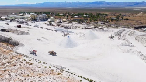 Salt Mining Facility in Nevada with Machinery and White Salt Mounds Stock Footage 318068025
