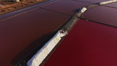 Salt mining process takes place in flat areas with water Stockbeeldmateriaal 335141468
