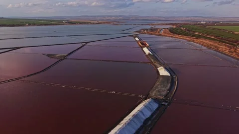 Salt mining process in wide salt flats near the coast Video stock 335141451