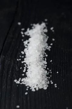 Salt over black table Stock Photos