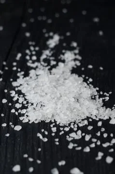 Salt over black table Stock Photos