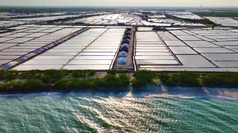 Salt Pans And Ocean - Drone Shot - Leftwards Video stock 253058388