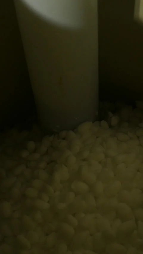 Salt Pellets inside Brine Tank or Water Filtration System  - Vertical Stock Footage 332576185