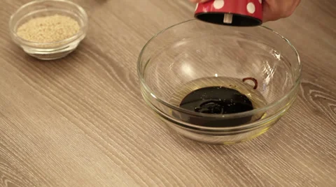 Salt, pepper, ground chilli and sesame seed added to marinade Stock Footage 36833005