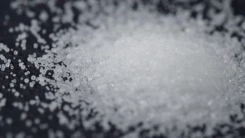 Salt Pile Close Up Left Edge Rotates on Black Stock Footage 80208428