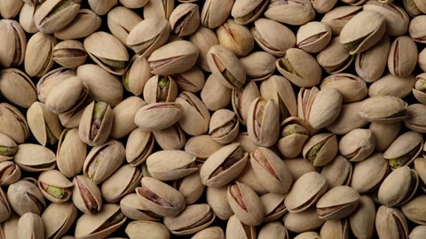 Salt pistachios nuts top view rotation. Pistachio nuts in the peel Stock-Footage 148288540