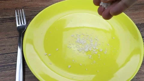Salt poured into a plate Stock Footage 150585577
