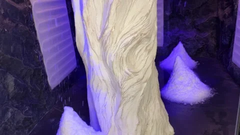 Salt room with decorative tree trunk and purple lighting Stock Footage 307227907