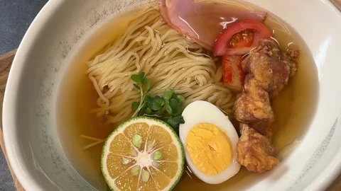 Salt Sauce Poured over Cold Ramen (Hiyashi Chuka), Traditional Japanese Food Stock Footage 345708651