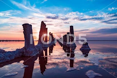Salt sea water evaporation ponds with pink plankton colour Stock Photos