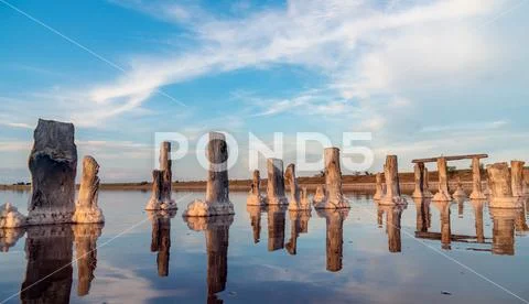 Salt sea water evaporation ponds with pink plankton colour Stock Photos