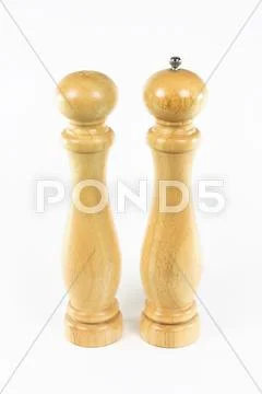 Salt shaker and black pepper mill. Stock Photos