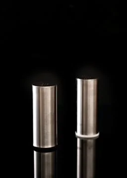 Salt shaker on black background Foto stock