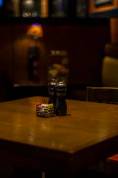 Salt shaker on table Stock Photos