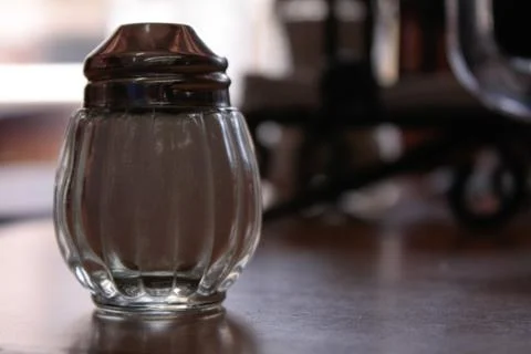 Salt shaker on the table Stock Photos
