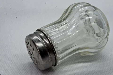 Salt shaker on white background Stock Photos