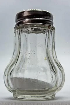 Salt shaker on white background Foto stock