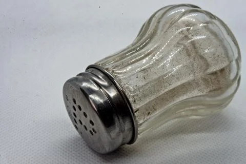 Salt shaker on white background Stock Photos