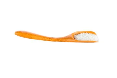Salt on the spoon Stock Photos