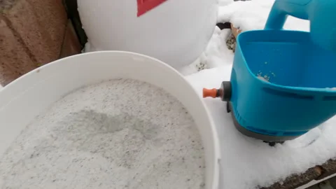Salt spreader in winter getting loaded in first person view action cam style Stock Footage 225448789