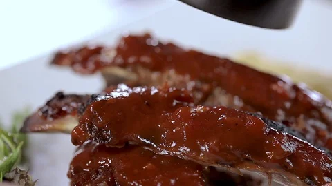 Salt Sprinkling on BBQ Ribs Stock Footage 90939059
