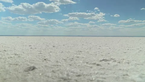 Salt on the surface of the earth, salt marsh, deserted white earth, the bottom Stock Footage 151529348