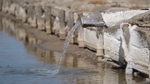 Salt water flows from the source into the pool Stock Footage 294087271