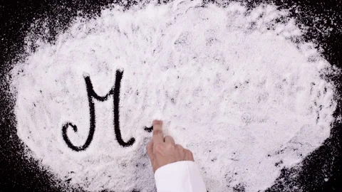 Salt Writing on Black Surface word Menu Stock Footage 248749935