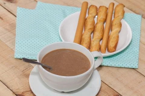 Salted bread stick and cup of coffee Stock Photos