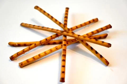 Salted Breadsticks on White Background, Minimal Snack Food Concept with Copy Spa Fotos Stock