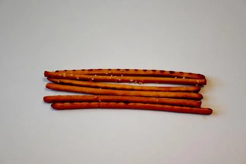 Salted Breadsticks on White Background, Minimal Snack Food Concept with Copy Spa 写真素材