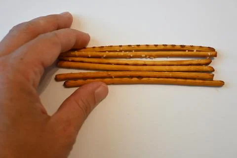 Salted Breadsticks on White Background, Minimal Snack Food Concept with Copy Spa Photos