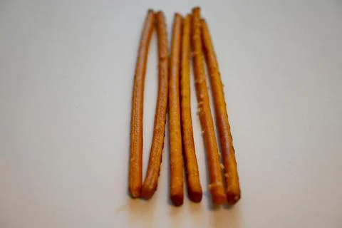 Salted Breadsticks on White Background, Minimal Snack Food Concept with Copy Spa Stock Photos