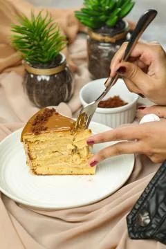 Salted Caramel Blondie cake slice include chocolate cream, sugar with fork,.. Stock Photos