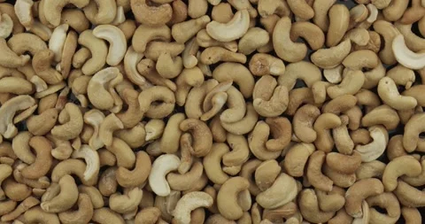 Salted cashew nuts closeup rotating loopable Stock Footage 147080598