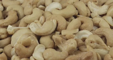 Salted cashew nuts closeup rotating loopable Stock Footage 148271492