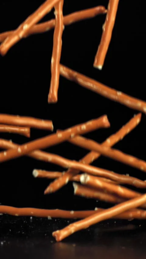 Salted cracker sticks fall on the table. Filmed on a high-speed camera at 1000 Stock Footage 335367453