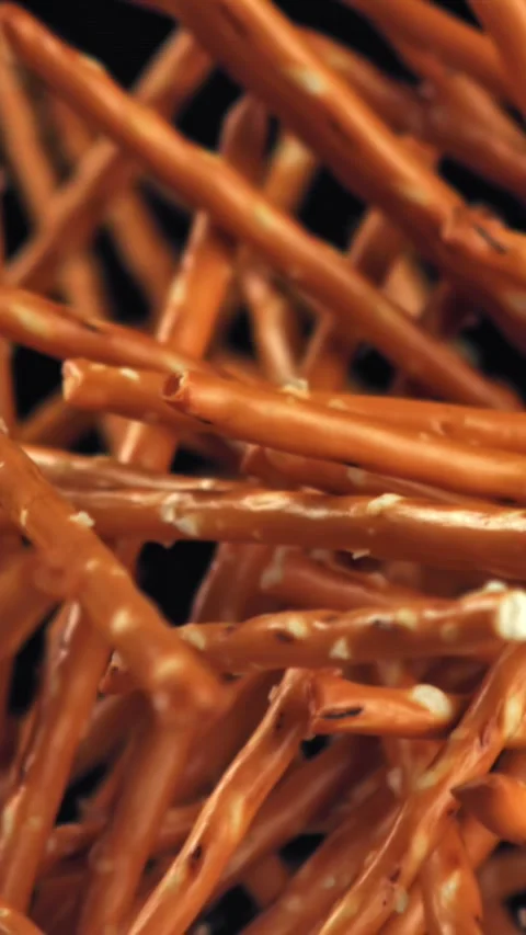 Salted cracker sticks fly and fall. Filmed on a high-speed camera at 1000 fps Stock Footage 335375765