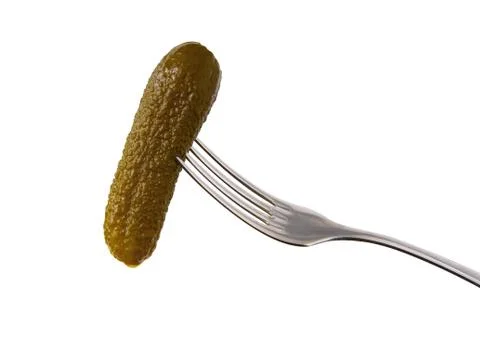 Salted cucumber on a fork close-up. Foto stock
