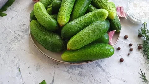 Salted cucumbers on gray concrete background slow motion Stock Footage 110185767