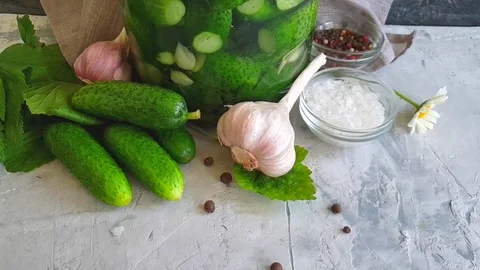 Salted cucumbers on gray concrete background slow motion Stock Footage 110186433