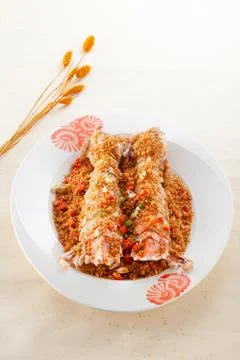 Salted deep fried Mantis prawns in Thai style on white plate Stock Photos
